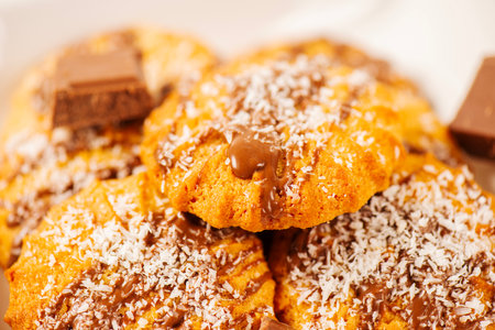 Fresh-baked Snickerdoodle cookies with chocolate and shredded coconut.の写真素材