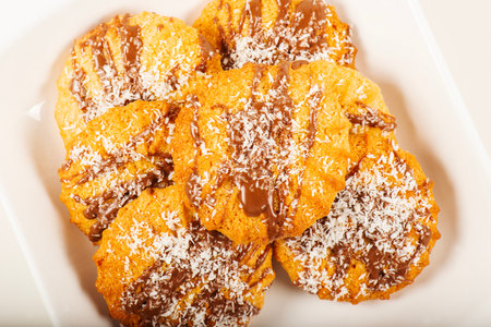 Fresh-baked Snickerdoodle cookies with chocolate and shredded coconut.の写真素材