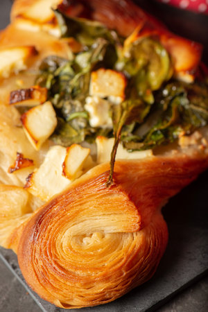 Mouth-watering spinach and feta Danish baked golden brown.の写真素材