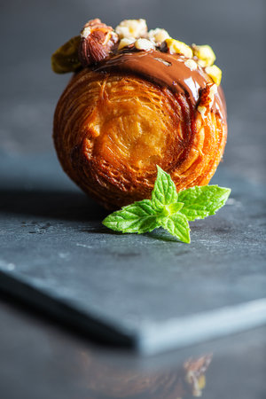 Petite Supreme Croissant also known as New York Rolls with drizzled chocolate, crushed pistachio and hazelnuts.の写真素材