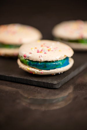 Delicious French sweet vanilla macaron with a velvet rainbow ganache.の写真素材