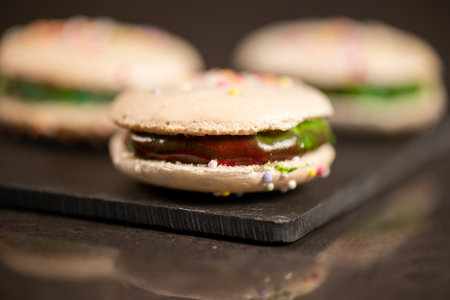 Delicious French sweet vanilla macaron with a velvet rainbow ganache.の写真素材