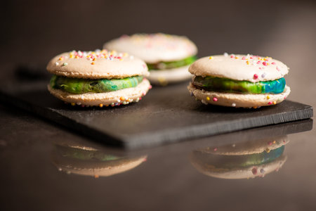 Delicious French sweet vanilla macaron with a velvet rainbow ganache.の写真素材