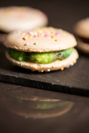 Delicious French sweet vanilla macaron with a velvet rainbow ganache.の写真素材