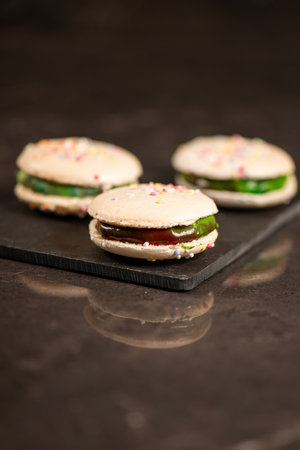 Delicious French sweet vanilla macaron with a velvet rainbow ganache.の写真素材