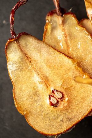 Candied pear chips, first dehydrated and then dipped in a caramel sugar solution and left to dry.の写真素材