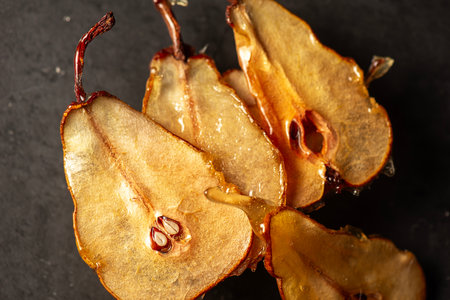 Candied pear chips, first dehydrated and then dipped in a caramel sugar solution and left to dry.の写真素材