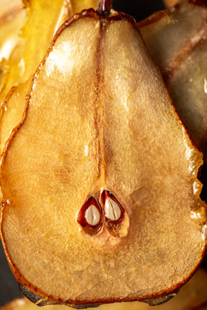 Candied pear chips, first dehydrated and then dipped in a caramel sugar solution and left to dry.の写真素材