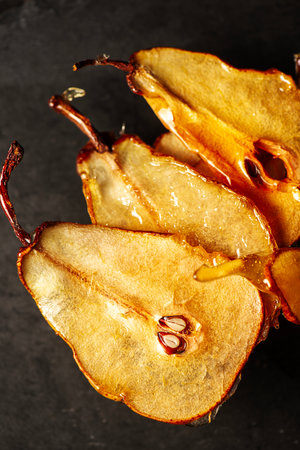 Candied pear chips, first dehydrated and then dipped in a caramel sugar solution and left to dry.の写真素材