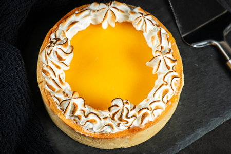 Lemon Meringue Pie made with shortcrust pastry, lemon curd, and torched Italian meringue.の写真素材