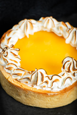 Lemon Meringue Pie made with shortcrust pastry, lemon curd, and torched Italian meringue.の写真素材