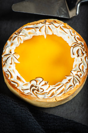 Lemon Meringue Pie made with shortcrust pastry, lemon curd, and torched Italian meringue.の写真素材
