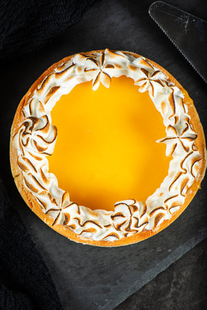 Lemon Meringue Pie made with shortcrust pastry, lemon curd, and torched Italian meringue.の写真素材