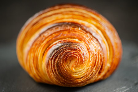Detailed close-up of crispy, flaky, and delicious butter croissantの写真素材