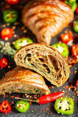 Homemade Tri-colour croissant with Jalapeno, birds eye and cayenne chilli butter.の写真素材