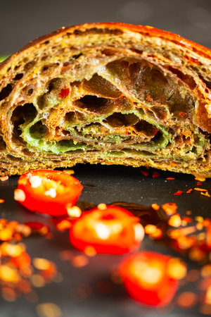 Homemade Tri-colour croissant with Jalapeno, birds eye and cayenne chilli butter.の写真素材
