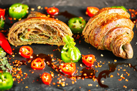 Homemade Tri-colour croissant with Jalapeno, birds eye and cayenne chilli butter.の写真素材