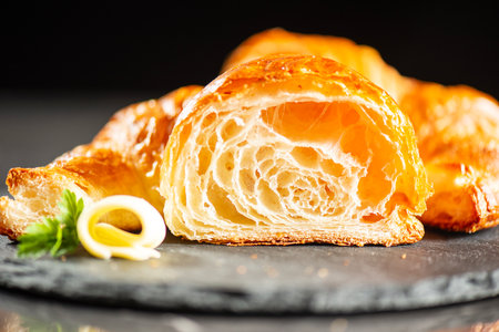 Delicious crispy, flaky and buttery plain croissant with a beautiful honeycomb.の写真素材