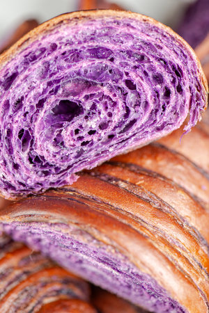 Fresh baked homemade Ube Croissant using traditional flavouring.の写真素材