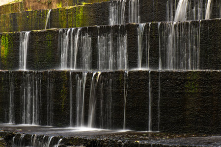 The Gold Creek Reservoir spillway isÂ a unique, stepped concrete structure, notable as the world's first of its kind.Â It's a staircase-like design with twelve steps, measuring 4.2 meters wide and 1.5 meters high.の写真素材