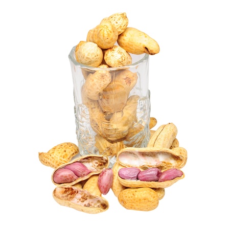 peanut in to glass on white background