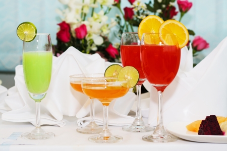 exotic cocktails and flowers on tableの写真素材