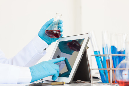 scientist in laboratory use tablet analysisの写真素材