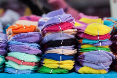 stack of socks in market, background.の写真素材