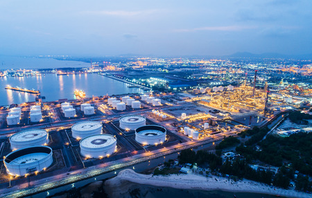 Aerial view or top view night light oil terminal is industrial facility for storage of oil and petrochemical. oil manufacturing products ready for transport and business transportation.のeditorial素材