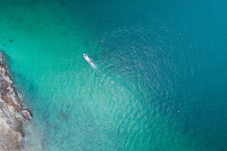 Aerial view on the sea and boat or speedboat. Beautiful natural seascape at the summer time. Island...