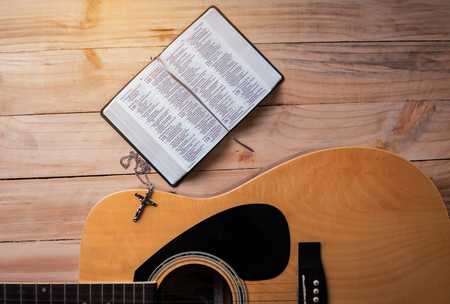Christian man Bible study. Bible, books and guitar worship God. freedom. Worship of God that respects and loves our God. Christianity. religionのeditorial素材