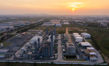 Aerial view drone of oil storage tank with oil refinery factory industrial. Oil refinery plant at beautiful sky sunset and twilight. industry factory concept and transportation.のeditorial素材
