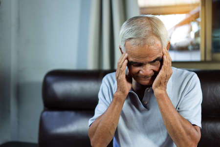 Asian senior man patients headache hands on forehead, Health problem retired asian old man hands...