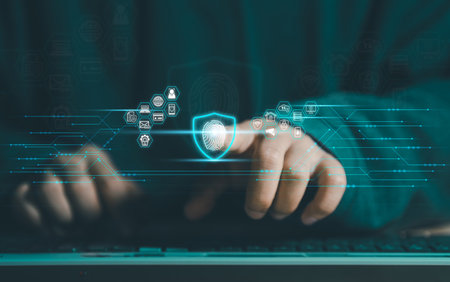 Cybersecurity and privacy concepts to protect data. Business Finger press on the fingerprint icon and internet network security technology. Virtual screen interfaces. cyber security.の写真素材