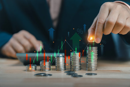Concepts of saving money and financial planning for real estate. Save money for investment concept. Stack of coins with trading chart in financial, stock market, Inflation and tax. wealth economy.の写真素材