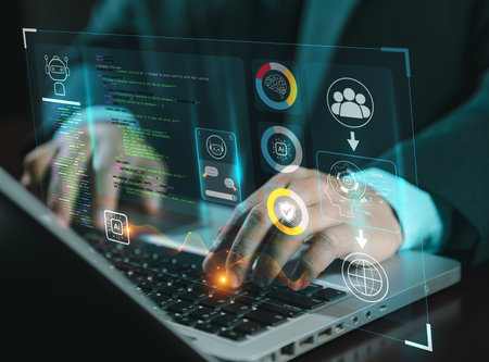 hands using typing keyboard with creative binary coding hologram on blurry background. Software programming code. Technology, web safety and programming concept.の写真素材