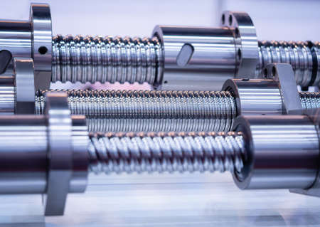 Steel rod with a screw thread and a metal round detail, in industrial applications.close-up.の写真素材