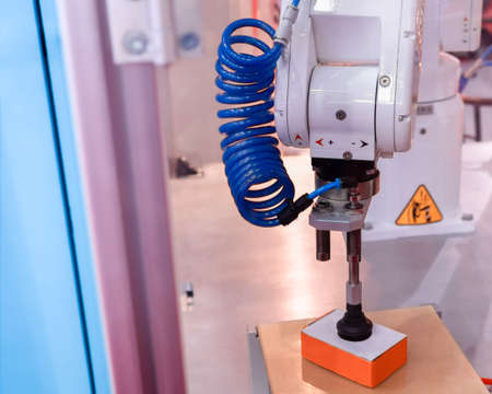 The robotic arm shows work. Suction boxes, industrial applications.の写真素材