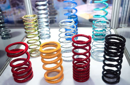 Multi-colored steel springs are displayed in the cabinet. Used in industrial applications.close-up.の写真素材