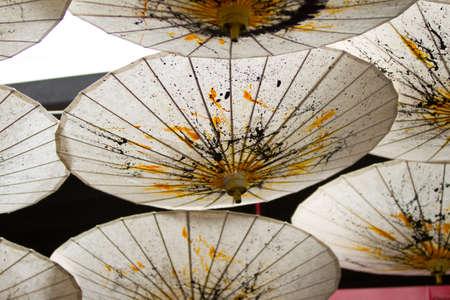 Japanese Mulberry Paper Umbrella Hand Painted with Yellow and Black.の写真素材