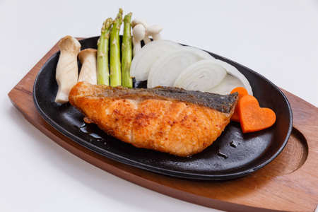 Grilled Japanese Salmon Steak with Mushroom, Asparagus, Sliced Onion and Carrot with Soy Sauce. Scallion Sauce and Mayonnaise.の写真素材