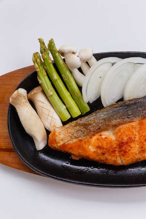 Grilled Japanese Salmon Steak with Mushroom, Asparagus, Sliced Onion and Carrot with Soy Sauce. Scallion Sauce and Mayonnaise.の写真素材