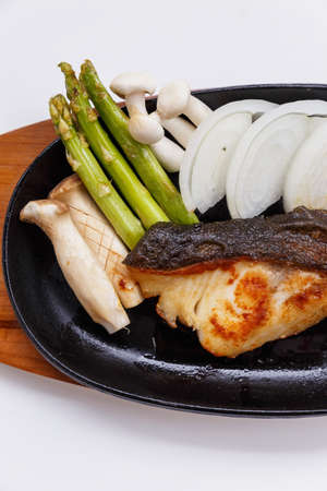 Grilled Japanese Sablefish Steak with Mushroom, Asparagus, Sliced Onion and Carrot with Soy Sauce. Scallion Sauce and Mayonnaise.の写真素材