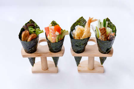 California Hand Roll Sushi Set : Foie Gras, Shrimp with Kani, Tamagoyaki, Avocado and Tobiko. Another is Shrimp Tempura and Crispy Tuna Skin with Sliced Cucumber.の写真素材