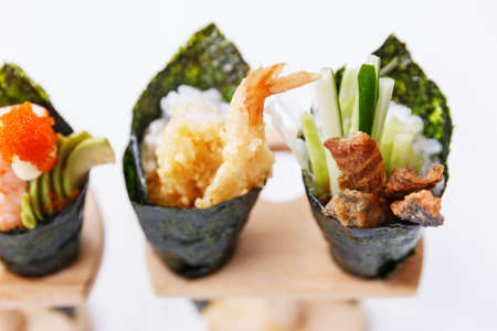 California Hand Roll Sushi Set : Foie Gras, Shrimp with Kani, Tamagoyaki, Avocado and Tobiko. Another is Shrimp Tempura and Crispy Tuna Skin with Sliced Cucumber.の写真素材