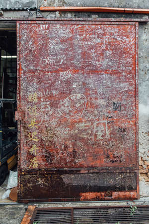 Letters that Drew by People on The Red Door from The Street of George Town. Penang, Malaysia.のeditorial素材