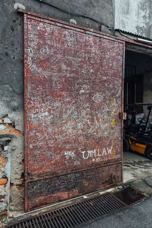 Letters that Drew by People on The Red Door from The Street of George Town. Penang, Malaysia.のeditorial素材