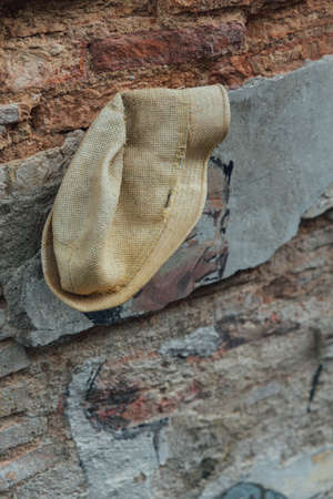 Detail of Painted Boy Playing Kite with Real Hat  on The Red Door with Red Brick Wall from The Street of George Town. Penang, Malaysia.のeditorial素材