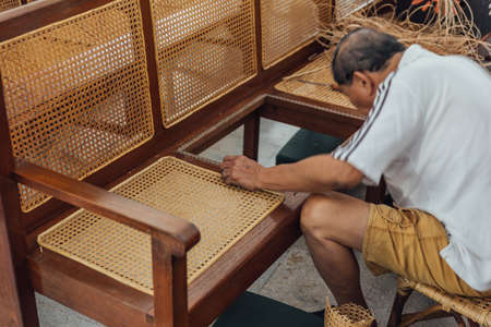 Man Fix Seat by weaving in St. George's Church is a 19th-century Anglican church in the city of George Town in Penang, Malaysia. It is the oldest purpose built Anglican church in South East Asia.のeditorial素材