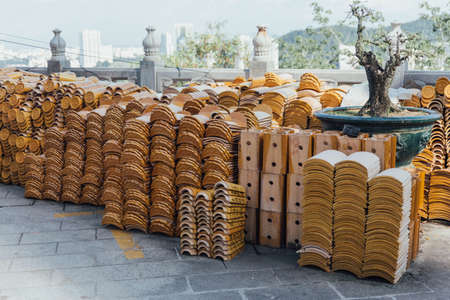 Yellow roof tiles with prayer's name for making merit at Kek Lok Si Temple at George Town. Panang, Malaysia.の写真素材